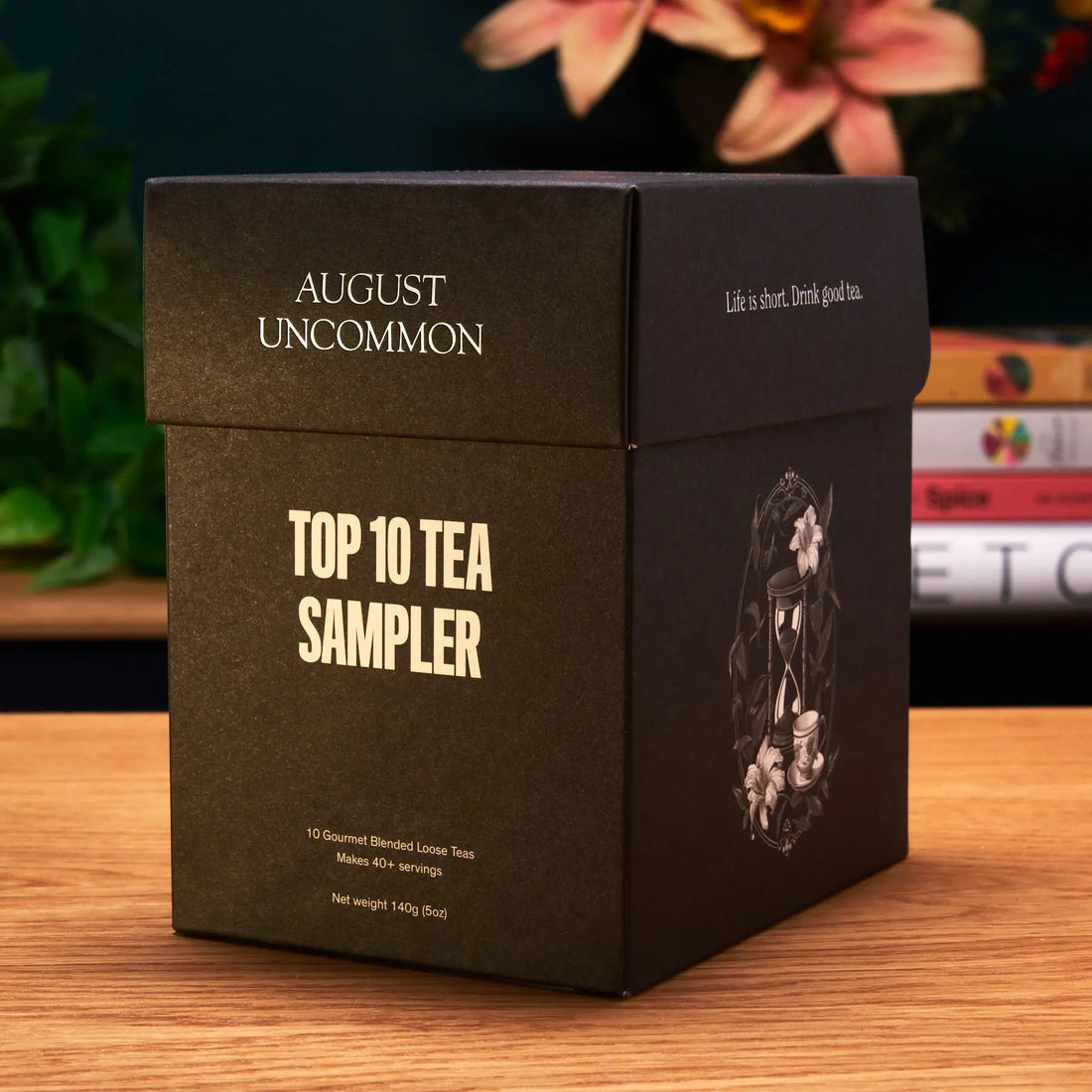August Uncommon Top 10 Tea Sampler box on a wooden table