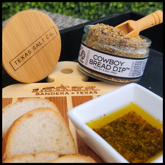 Texas Salt Co Cowboy Bread Dip jar with bread and a dish of prepared dipping oil
