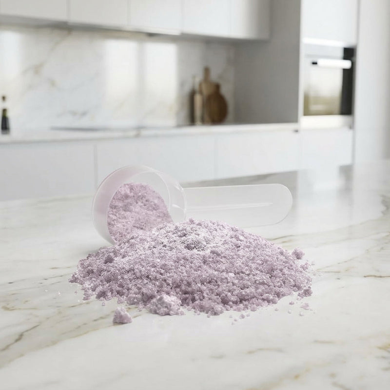 CogniGrape Nootropic Focus & Smart Energy Sour Grape Powder powder container on counter of white marble kitche