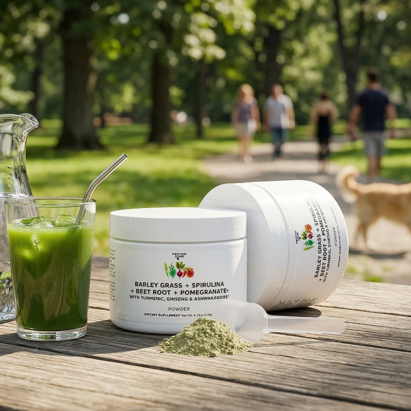Green Superfood Energy Complex powder container on table in park with pitcher of water 1